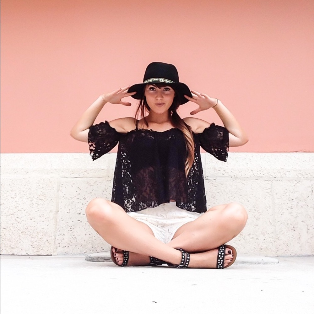 Black off shoulder laced top.